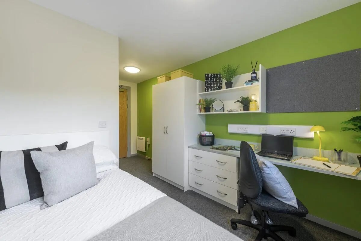 Bed desk closet whiteboard and laptop bedroom at Bryson Court in Newcastle Upon Tyne Student Accommodation