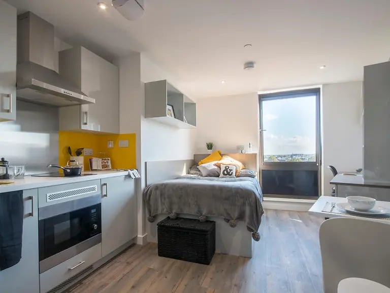 Kitchen bed desk and window studio apartment at Glendower House in Cardiff Student Accommodation