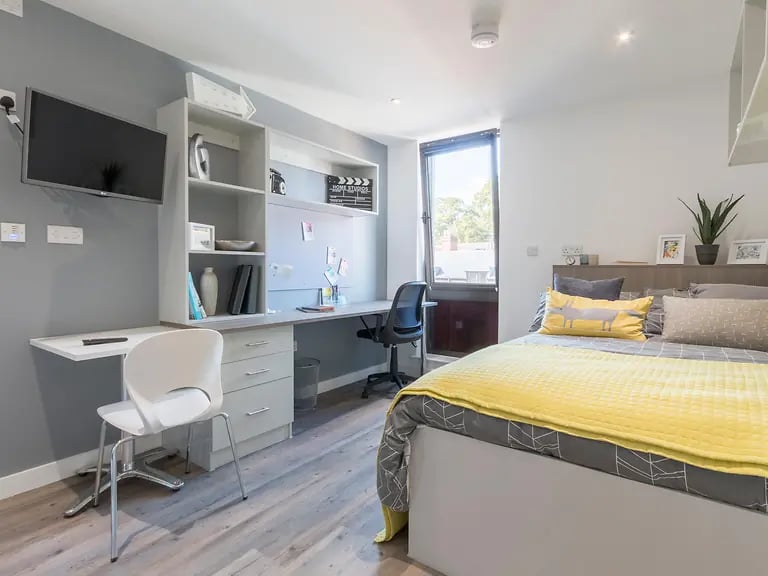 Desk bed shelving TV study area bedroom at Glendower House in Cardiff Student Accommodation