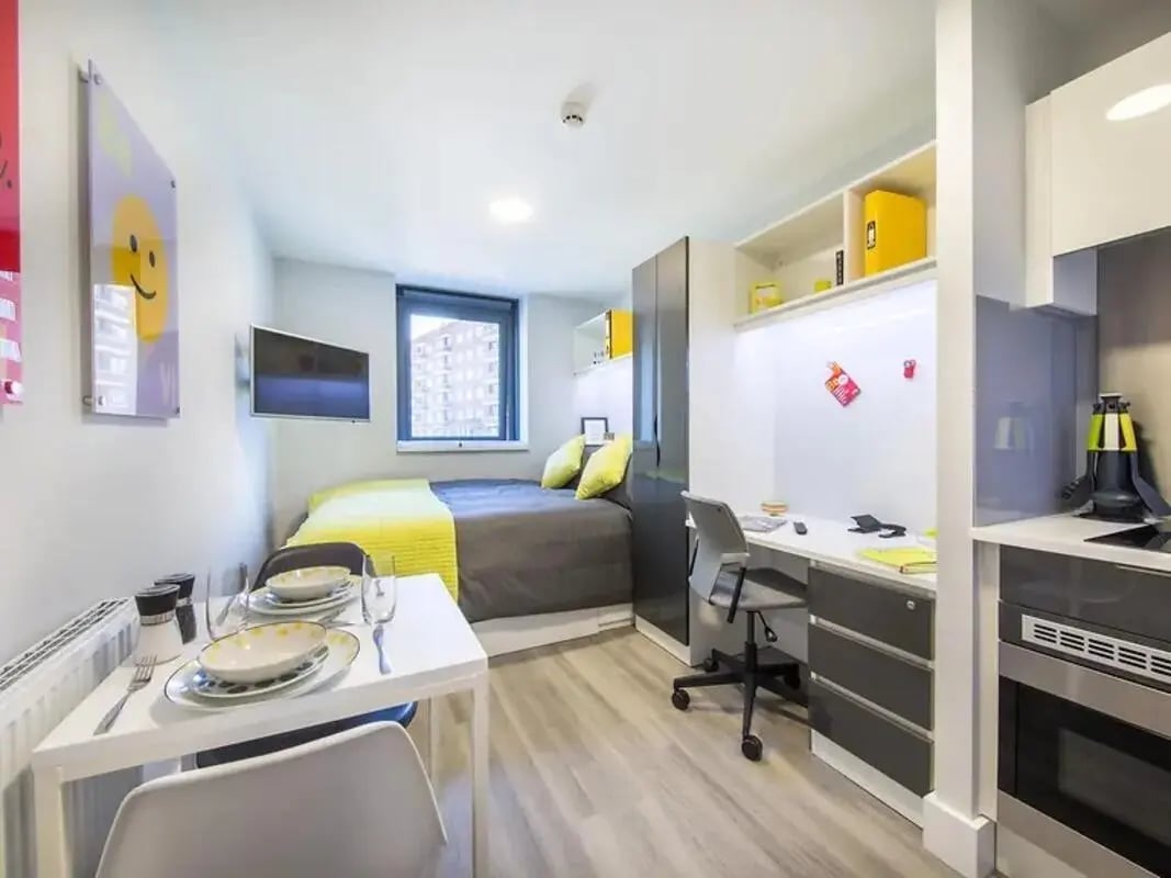 Bed desk and small kitchen student studio at ViBe Student Living in Kingston Upon Thames Student Accommodation