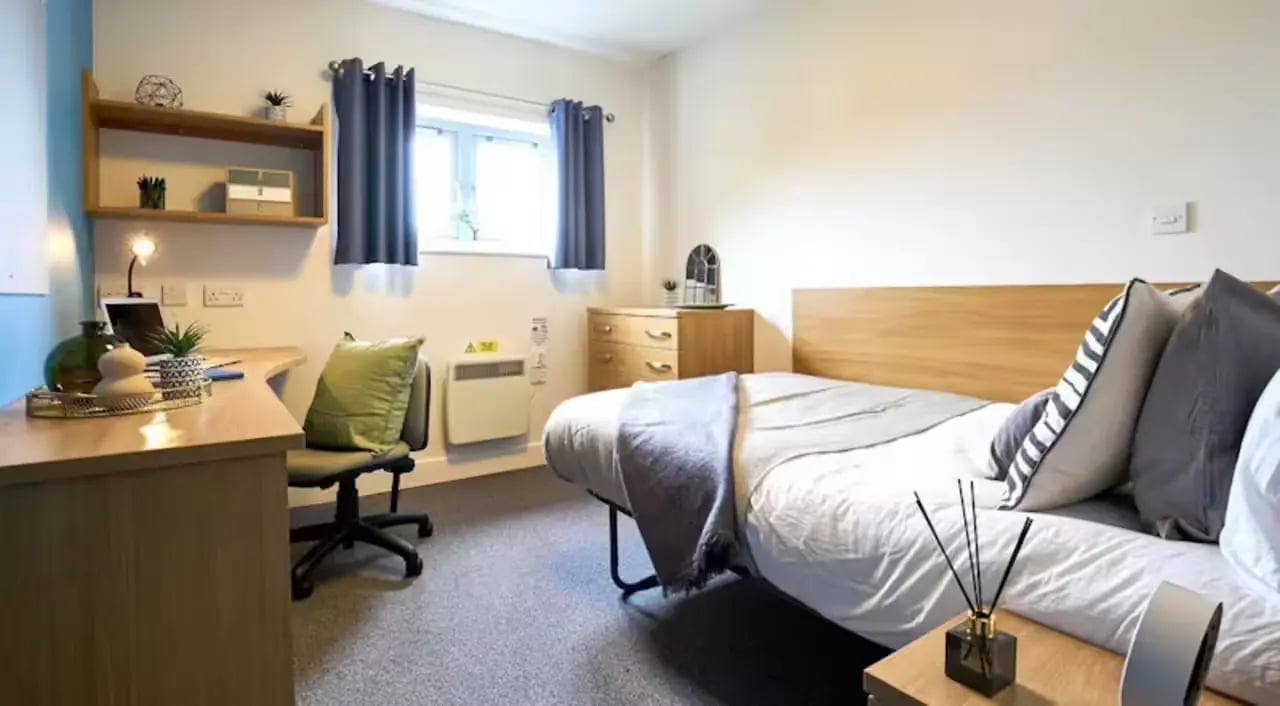 Desk bed dresser window and heater bedroom at Barker House in Newcastle Upon Tyne Student Accommodation
