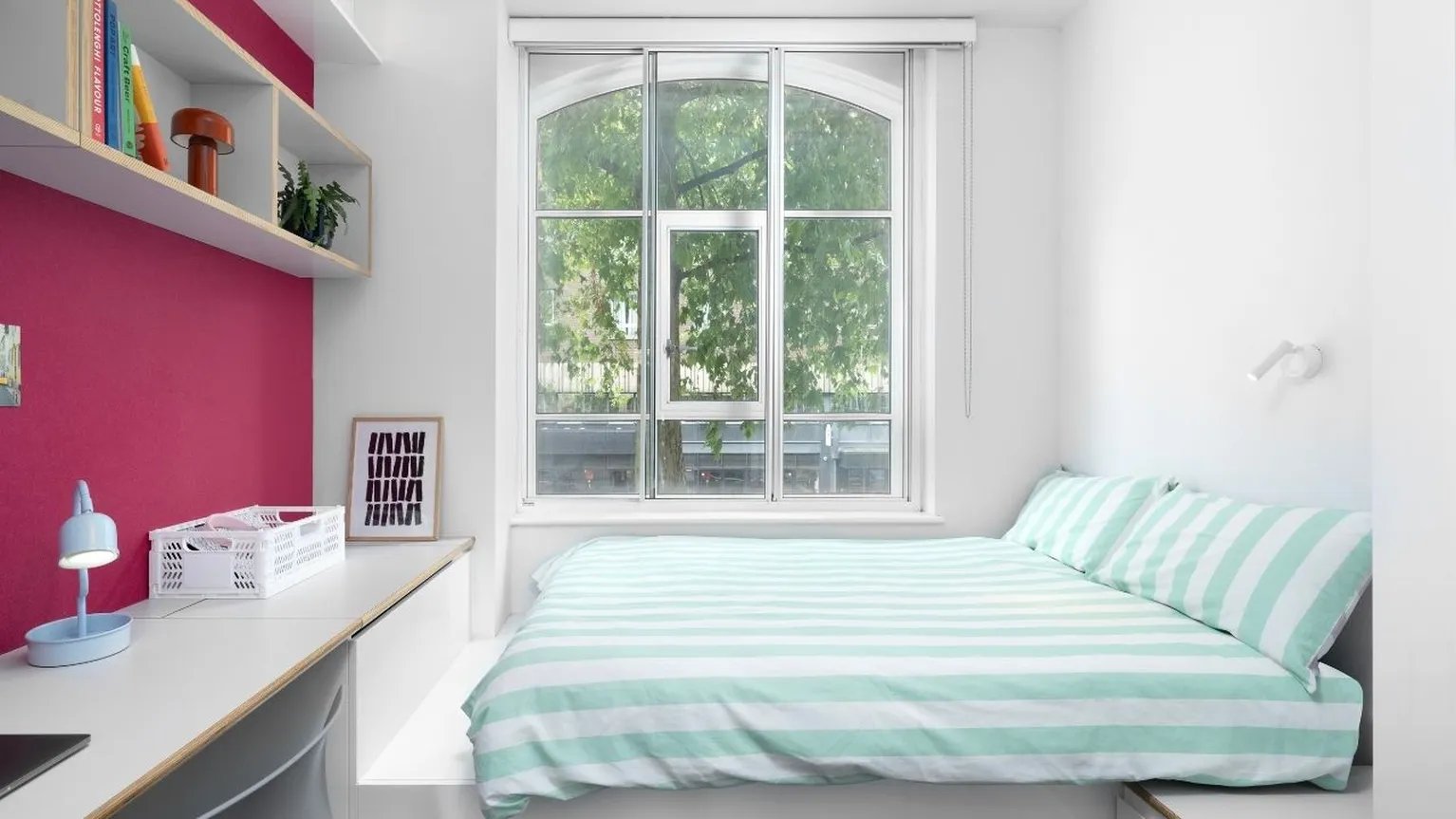 Striped bedding and desk with lamp bedroom at Scape Bloomsbury in London Student Accommodation