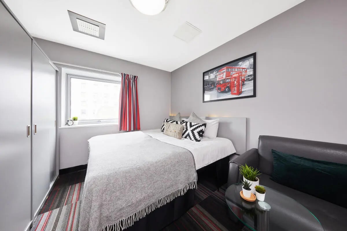Bed sofa rug artwork and wardrobe bedroom at Clarendon Street in Nottingham Student Accommodation