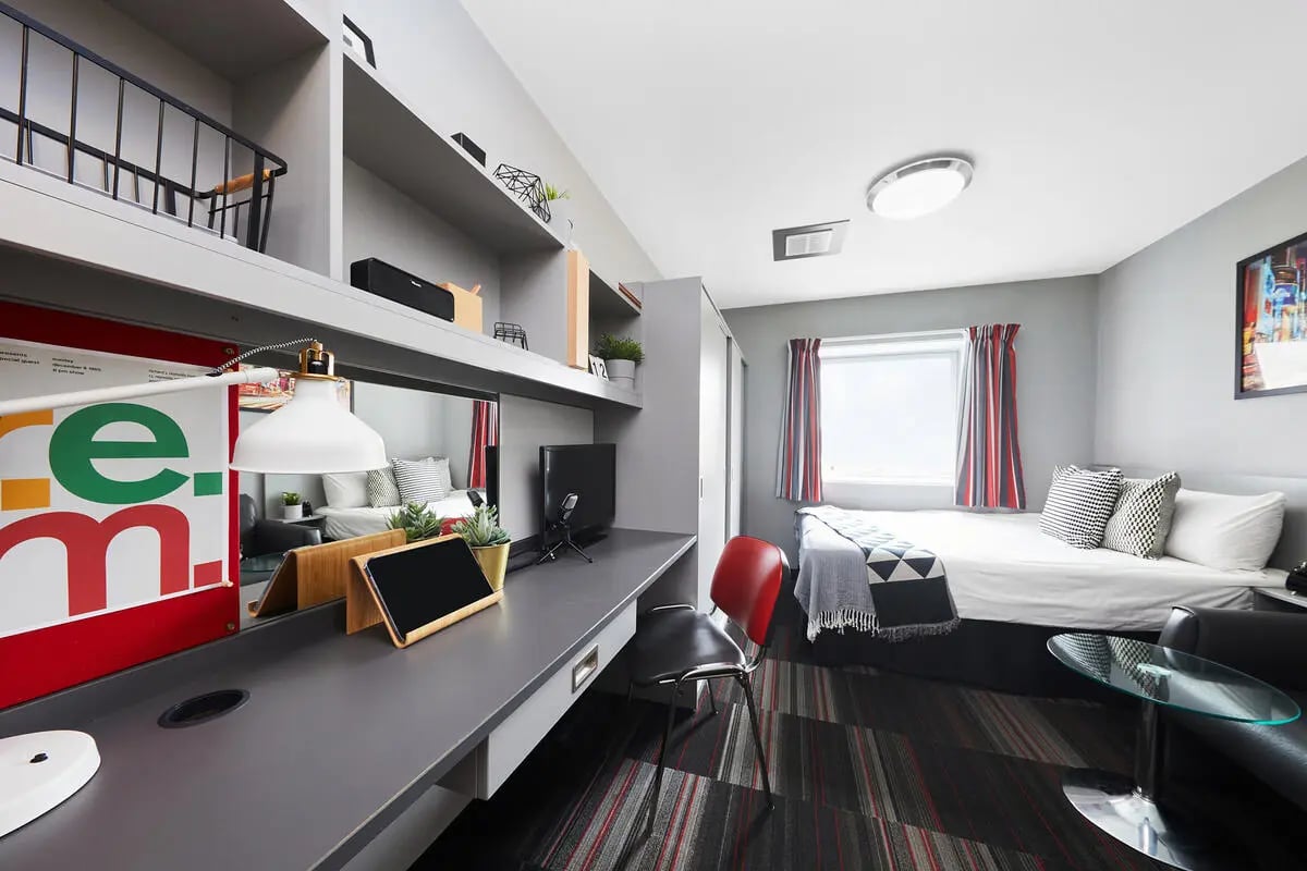 Bed desk shelves tablet chair and bed bedroom at Clarendon Street in Nottingham Student Accommodation