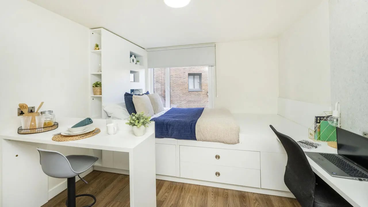 Bed desk with chair and shelves bedroom at The Glassworks Newcastle in Newcastle Upon Tyne Student Accommodation