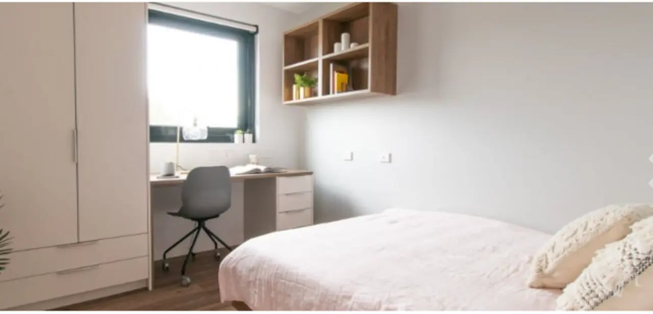 Wardrobe desk chair and bed bedroom at UniLodge Park Avenue in Melbourne Student Accommodation