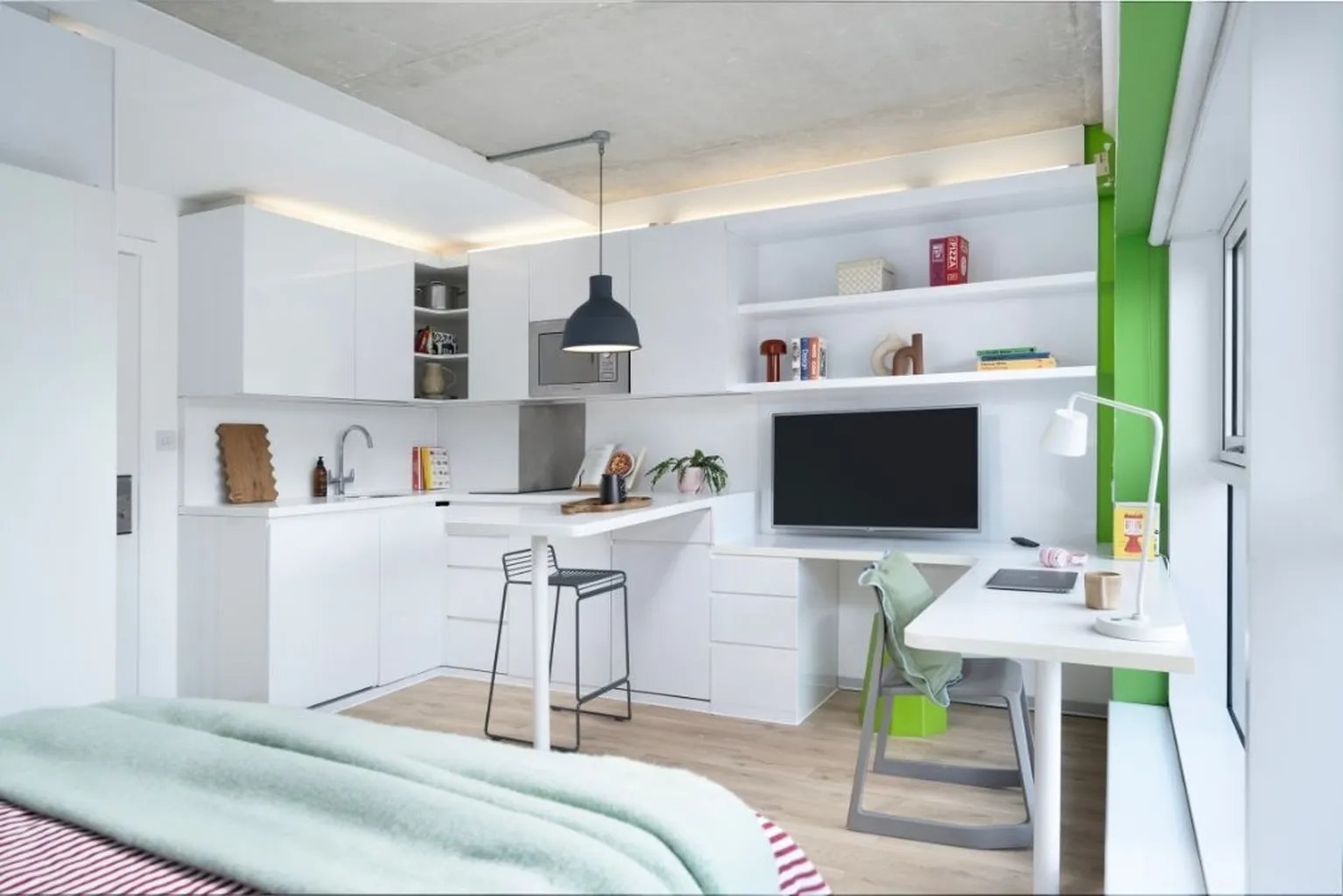 Kitchen bar desk TV shelving study area living room at Scape Shoreditch in London Student Accommodation