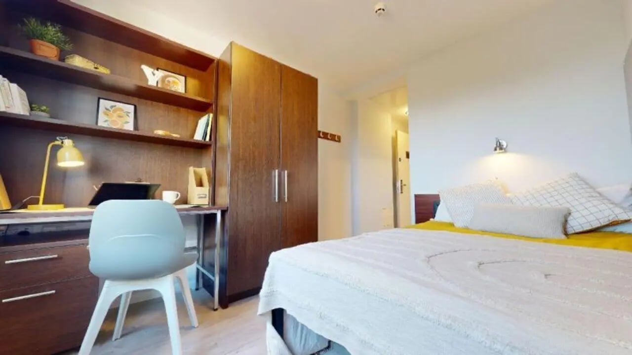 Bed desk and wardrobe bedroom at iQ Highbury in London Student Accommodation