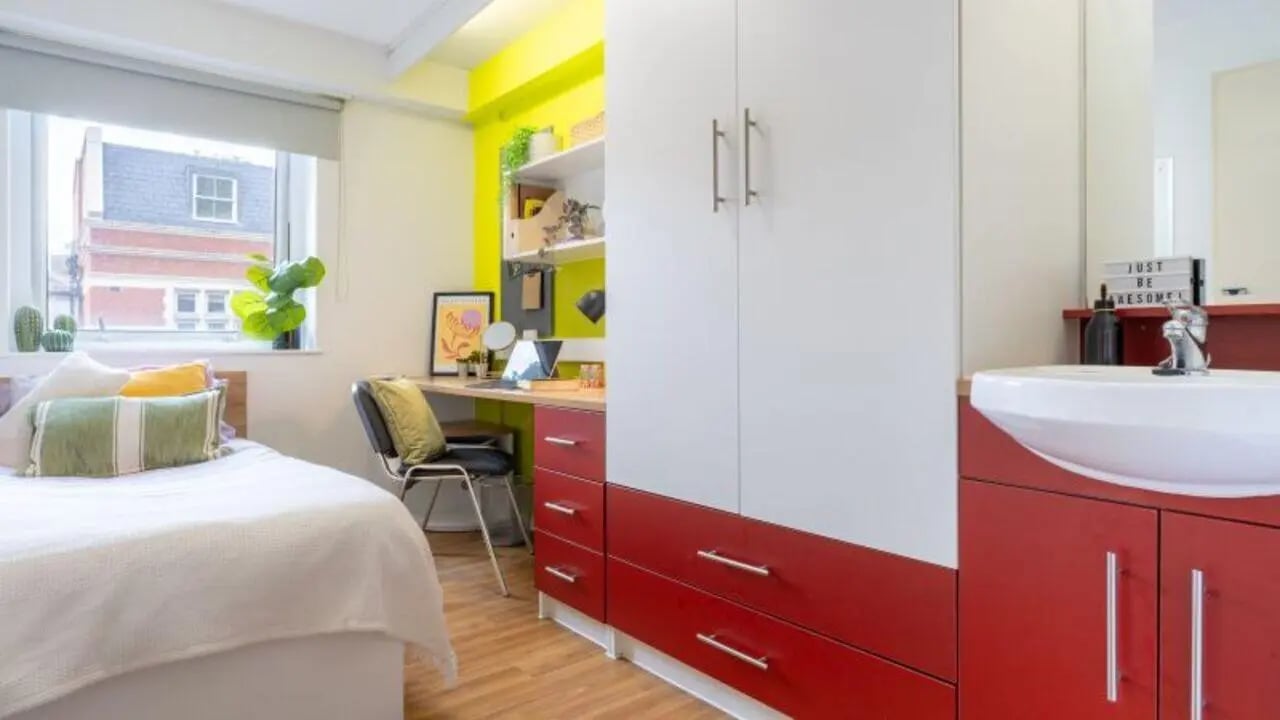 Bed desk wardrobe sink bathroom bedroom at iQ The Arcade in London Student Accommodation