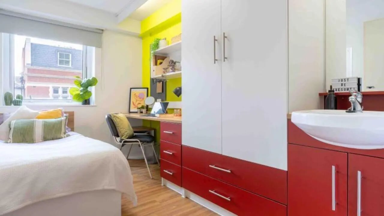 Bed desk wardrobe sink and bed bedroom at iQ The Arcade in London Student Accommodation