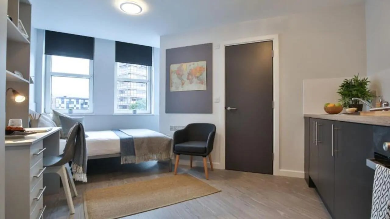 Bed desk chair and kitchenette student studio at Newtown House and Newland House in Nottingham Student Accommodation