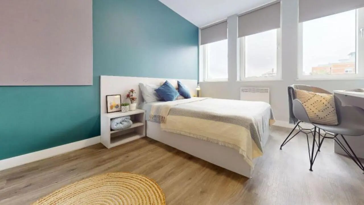 Bed nightstand lamp chair desk rug bedroom at Newtown House and Newland House in Nottingham Student Accommodation