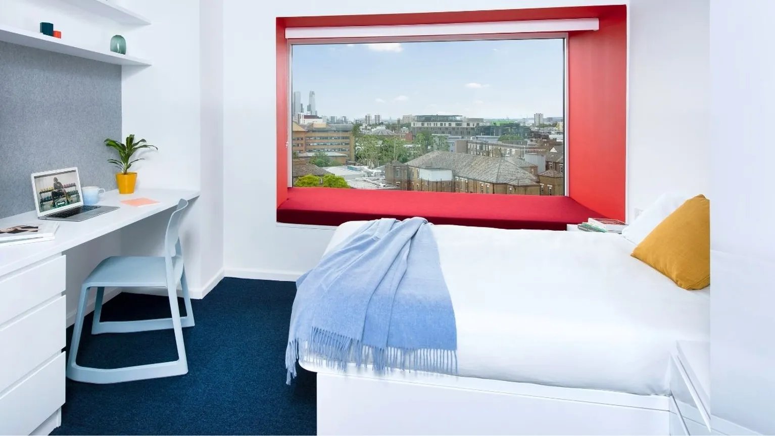 Desk laptop chair bed with blanket bedroom at Scape Mile End in London Student Accommodation