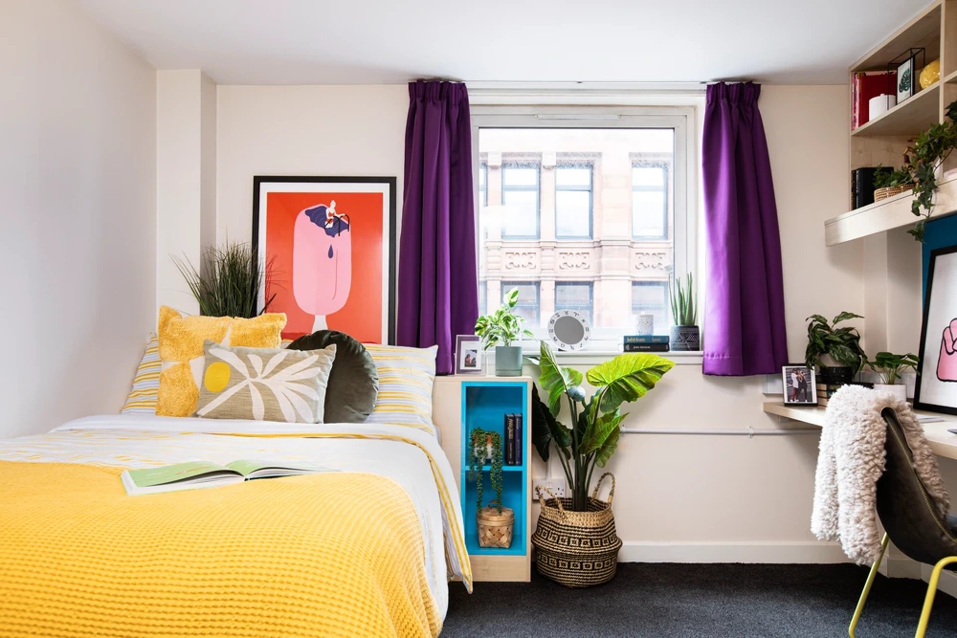 Bed pillows artwork shelf desk and chair bedroom at Merchant City House in Glasgow Student Accommodation