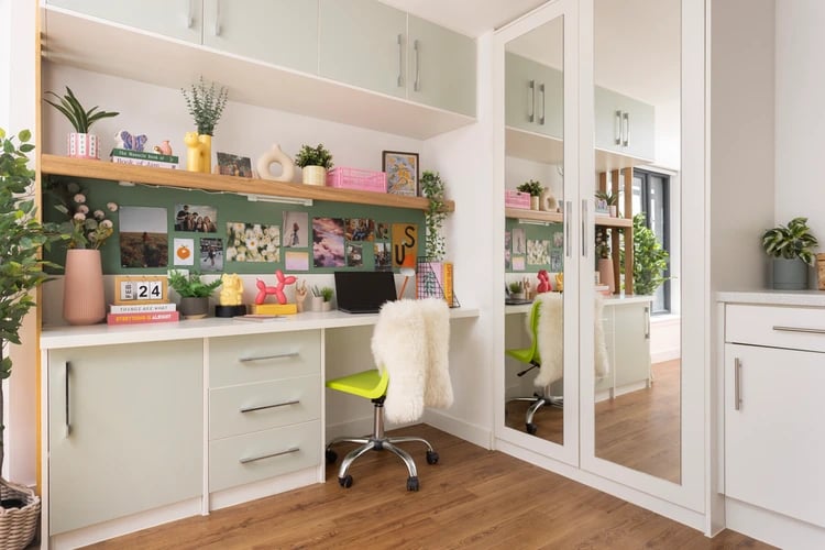 Desk with photos and chair study area at Tramworks in Glasgow Student Accommodation