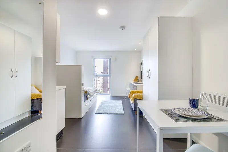 Two beds desks and dining area studio apartment at Lucas Studios in Birmingham Student Accommodation