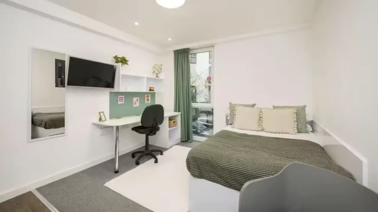Bed desk mirror TV and shelving bedroom at The Glassworks Leicester in Leicester Student Accommodation
