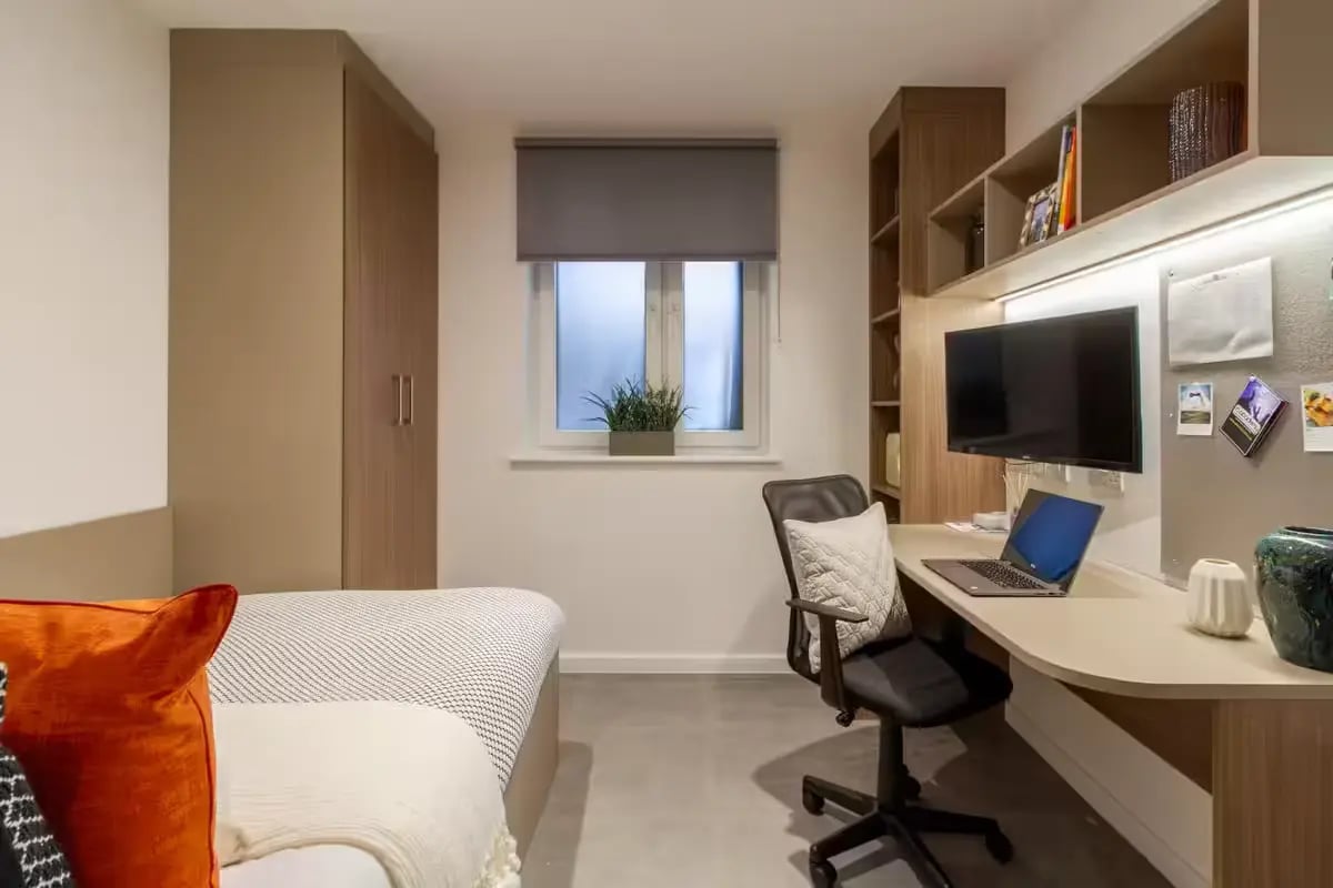 Bed desk laptop TV shelves storage bedroom at Dean Street Works in Bristol Student Accommodation
