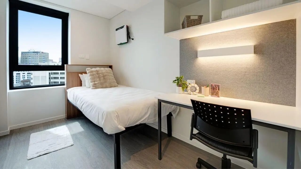 Bed desk and chair student bedroom. at UniLodge Auckland Central in Auckland Student Accommodation