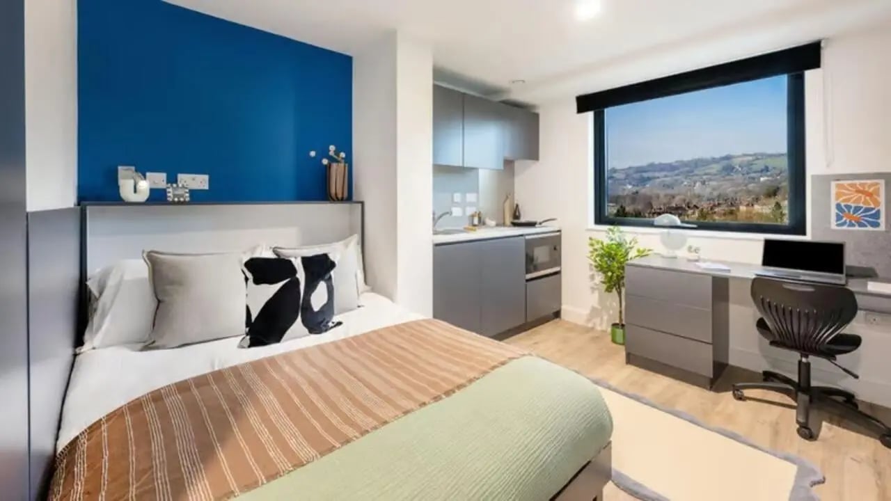 Bed, desk, kitchen, and landscape view bedroom at Hollis Wharf in Bath Student Accommodation