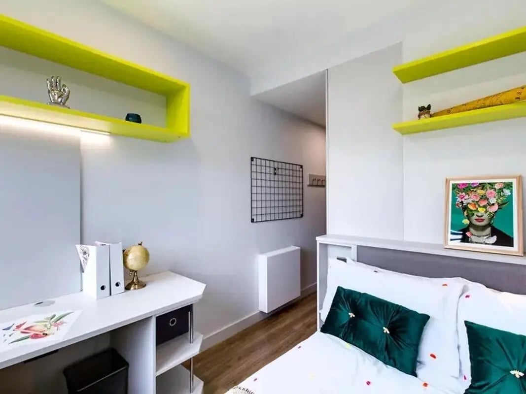 Desk, shelves, bed with pillows, framed art Bedroom at Ardcairn House in Dublin Student Accommodation