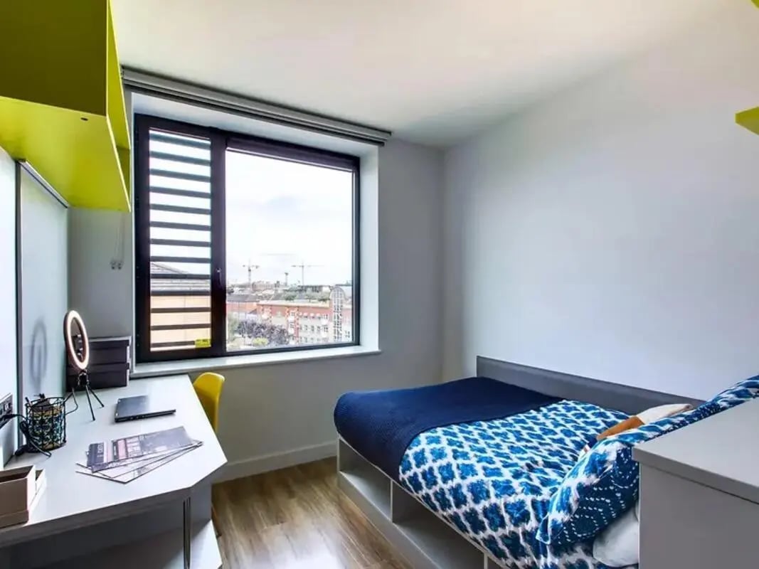 Bed desk and bright accents bedroom at Ardcairn House in Dublin Student Accommodation