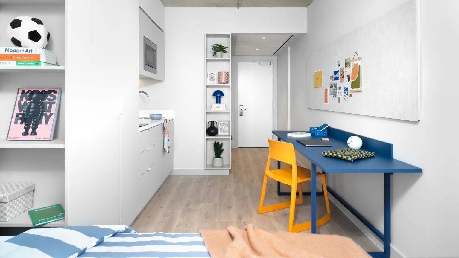 Bed desk kitchen shelves and a whiteboard studio at Scape Hammersmith in London Student Accommodation