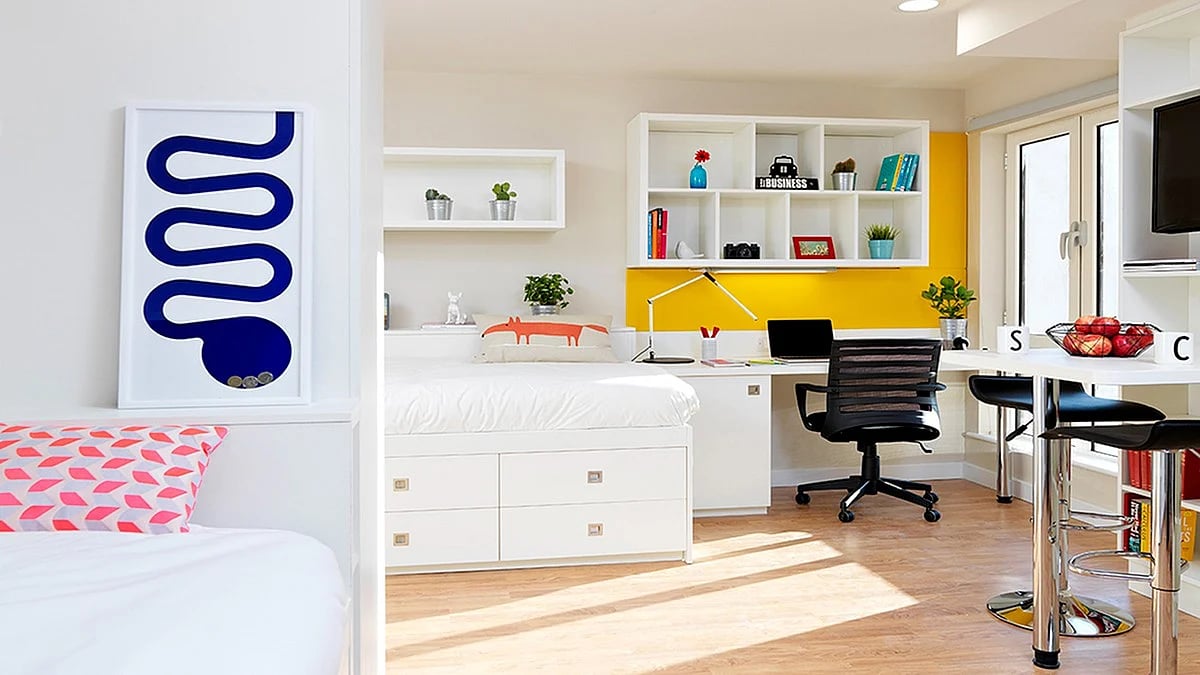 Bed desk chairs and table student accommodation bedroom at Student Castle Cambridge in Cambridge Student Accommodation