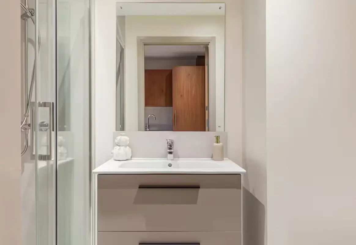 Modern sink and shower with mirrored cabinet Bathroom at Ryan Hall in Belfast Student Accommodation