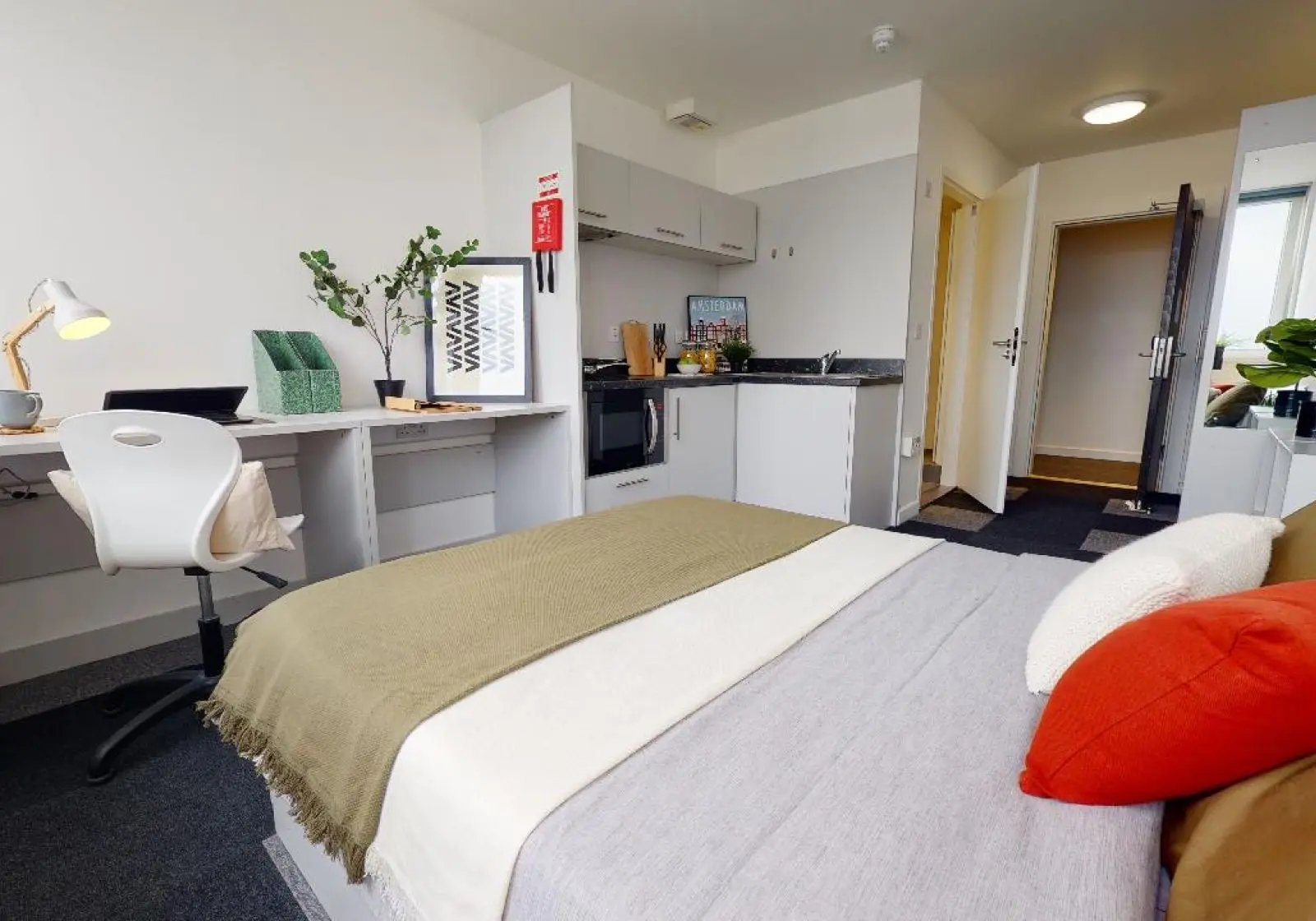 Desk bed and kitchen area bedroom at iQ Newtown House in Nottingham Student Accommodation