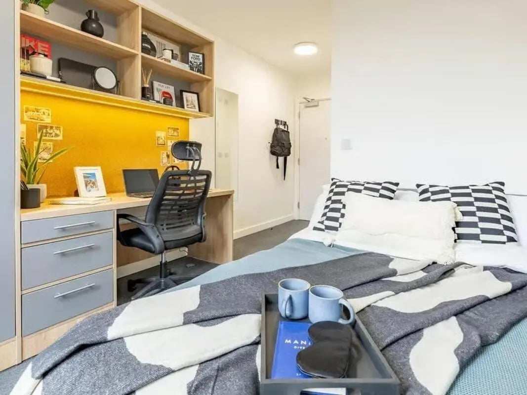 Desk bed and shelves student accommodation bedroom at Globe Works in Birmingham Student Accommodation