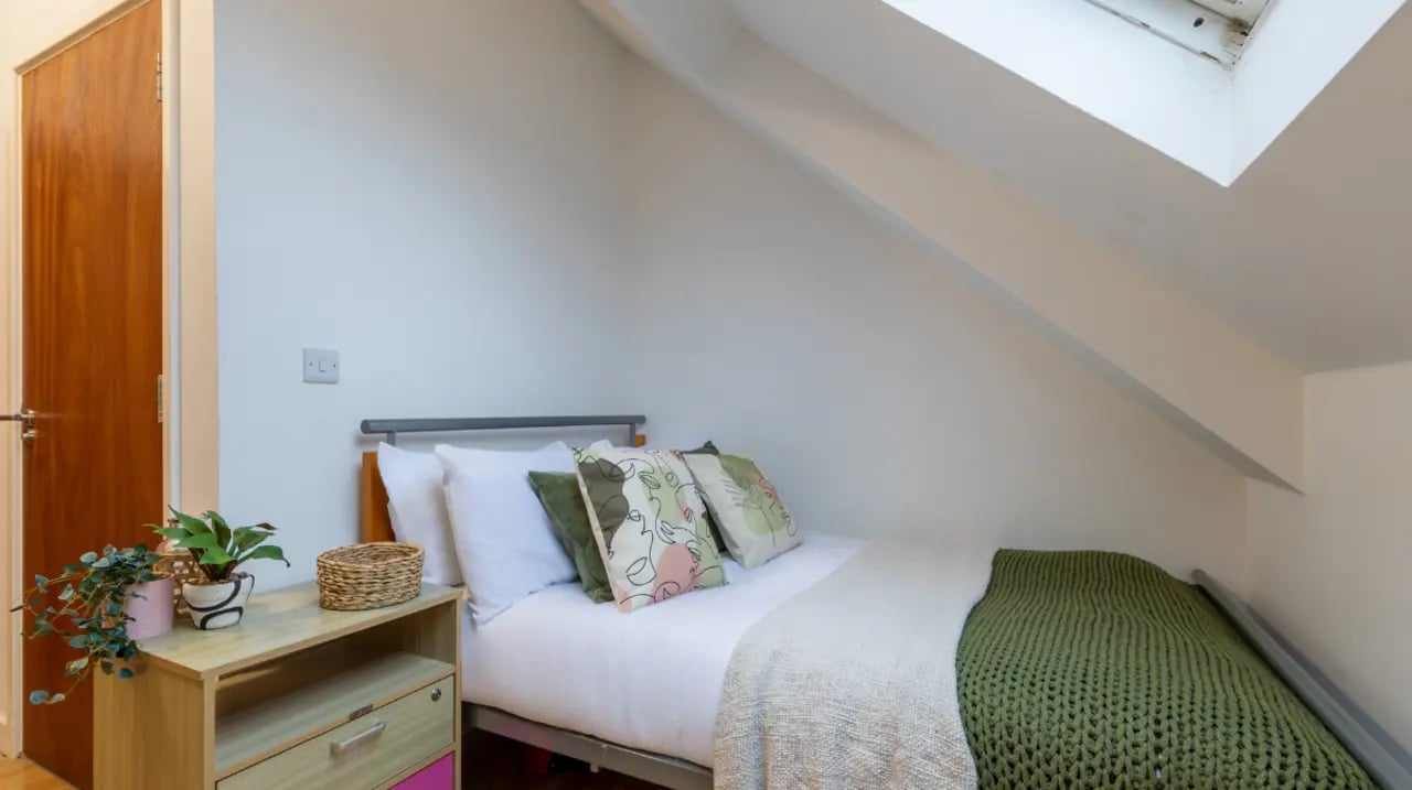Bed with pillows and bedside table Bedroom at dwell Castle Gate Haus in Nottingham Student Accommodation