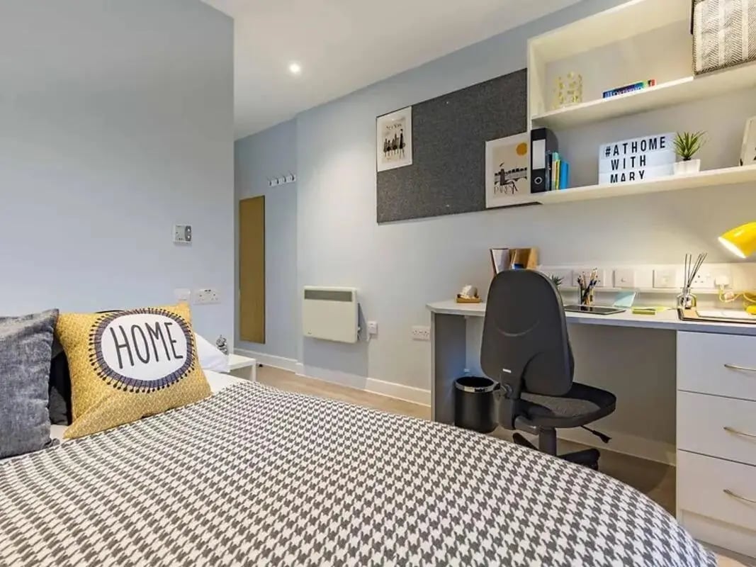 Bed desk chair and shelves bedroom at Mary Parker House in Plymouth Student Accommodation