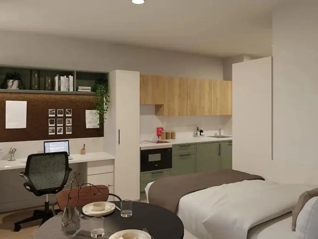 Desk chair laptop kitchen and bed studio at Yugo Haüs in Birmingham Student Accommodation