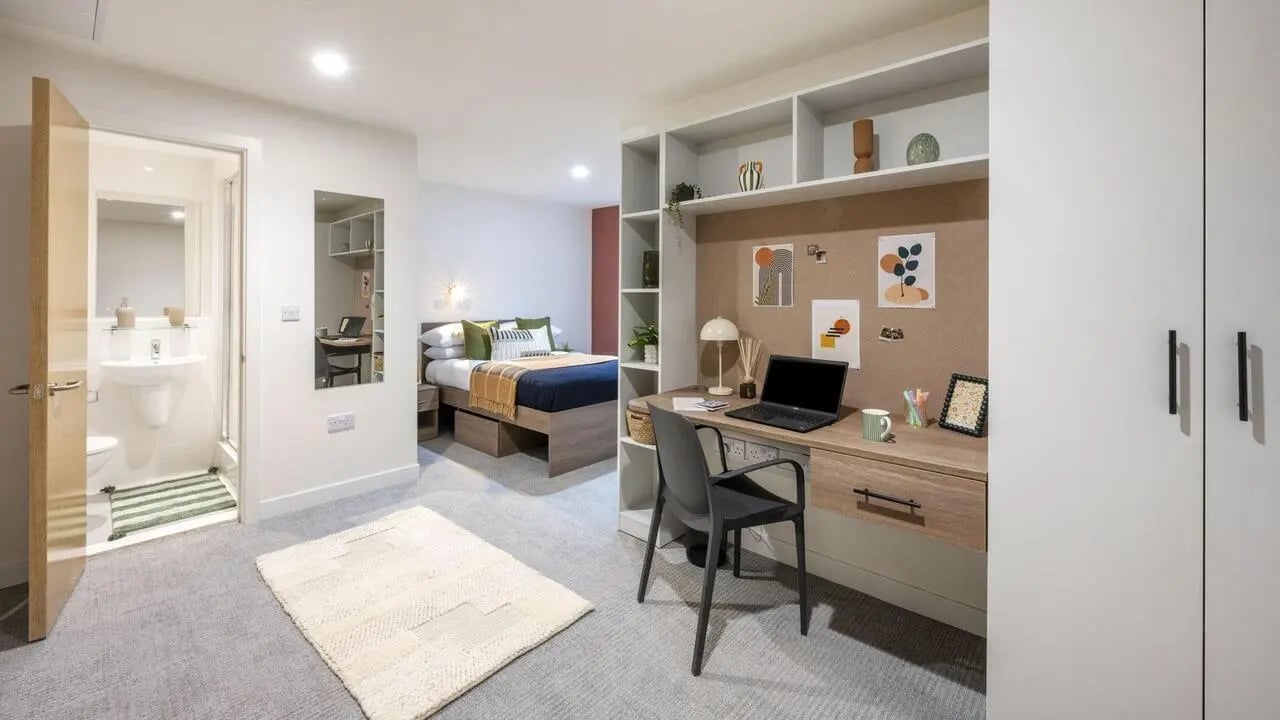 Bed desk study area bathroom and bedroom at Raffles Hall in York Student Accommodation