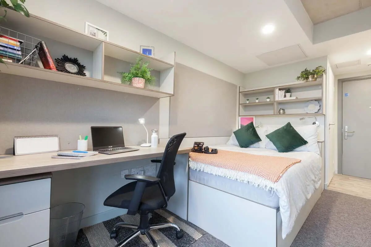 Desk bed with laptop chair shelves Bedroom at LIV Student Sheffield in Sheffield Student Accommodation