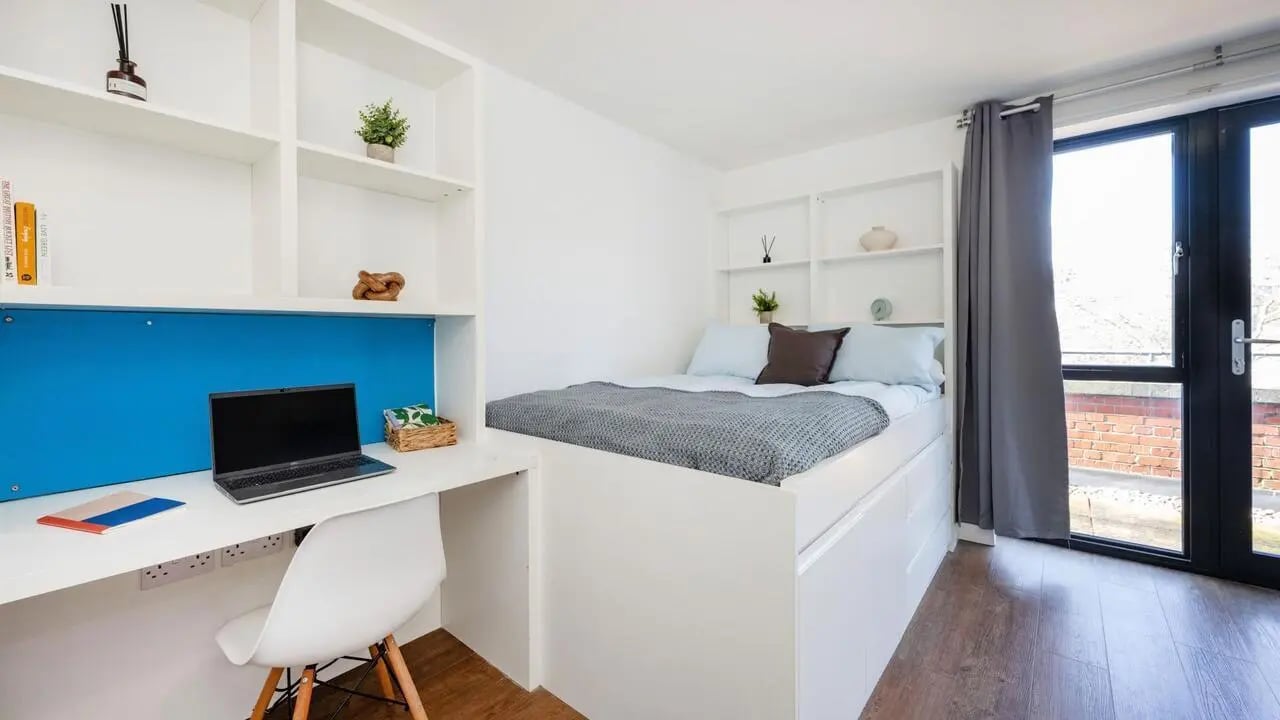 Bed desk chair and shelves Bedroom at The Colston in Bristol Student Accommodation