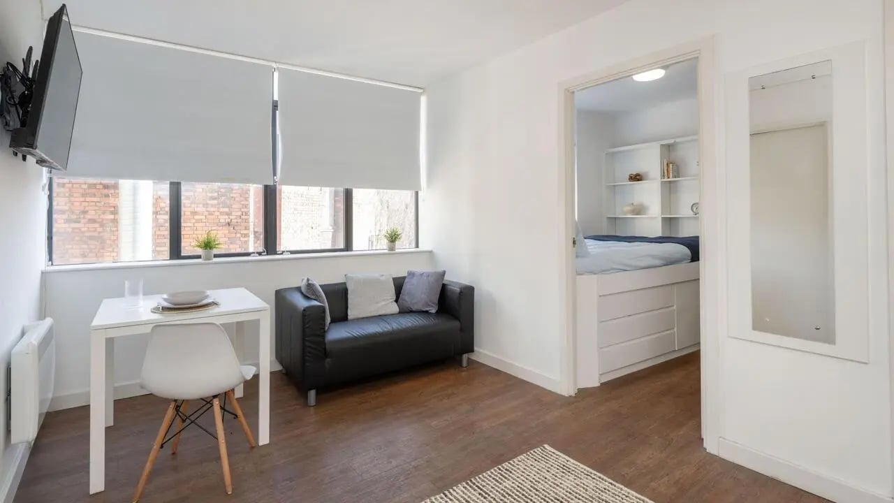 Sofa table chair and bed studio apartment at The Colston in Bristol Student Accommodation
