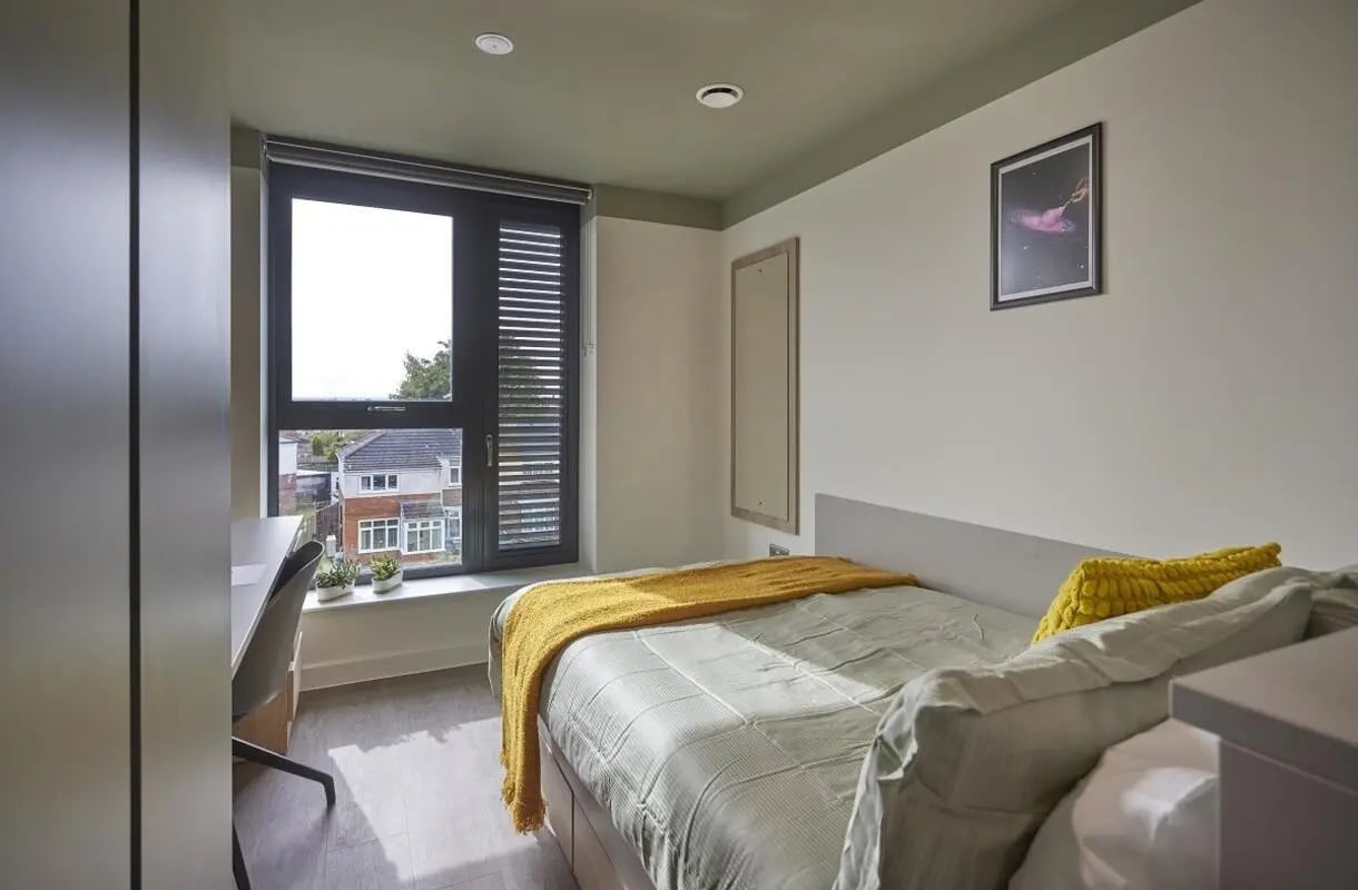 Bed desk window and houses bedroom at Regatta Place in Durham Student Accommodation