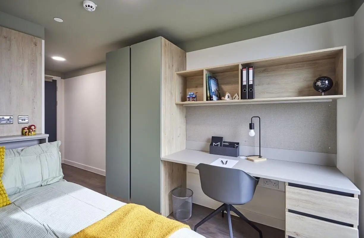 Bed desk wardrobe and shelves bedroom at Regatta Place in Durham Student Accommodation
