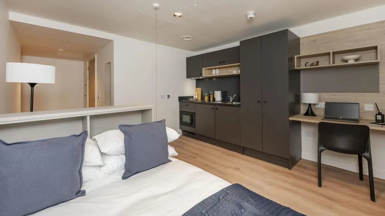 Bed kitchen area and desk studio apartment at Straits Place in Edinburgh Student Accommodation