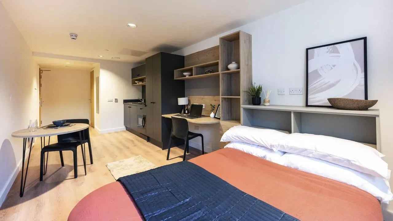 Bed desk kitchen table dining area studio apartment at Straits Place in Edinburgh Student Accommodation