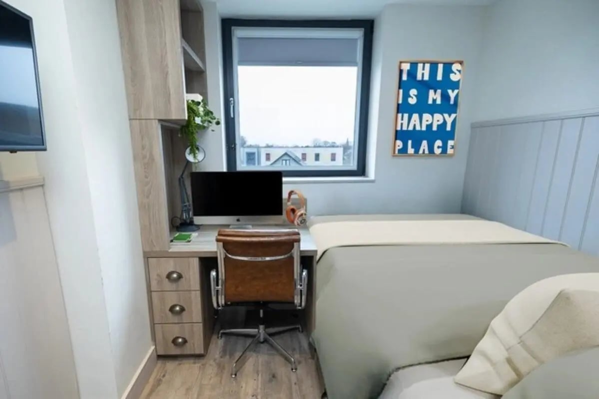 Desk chair computer bed and picture bedroom at Canvas The Parade in Cardiff Student Accommodation