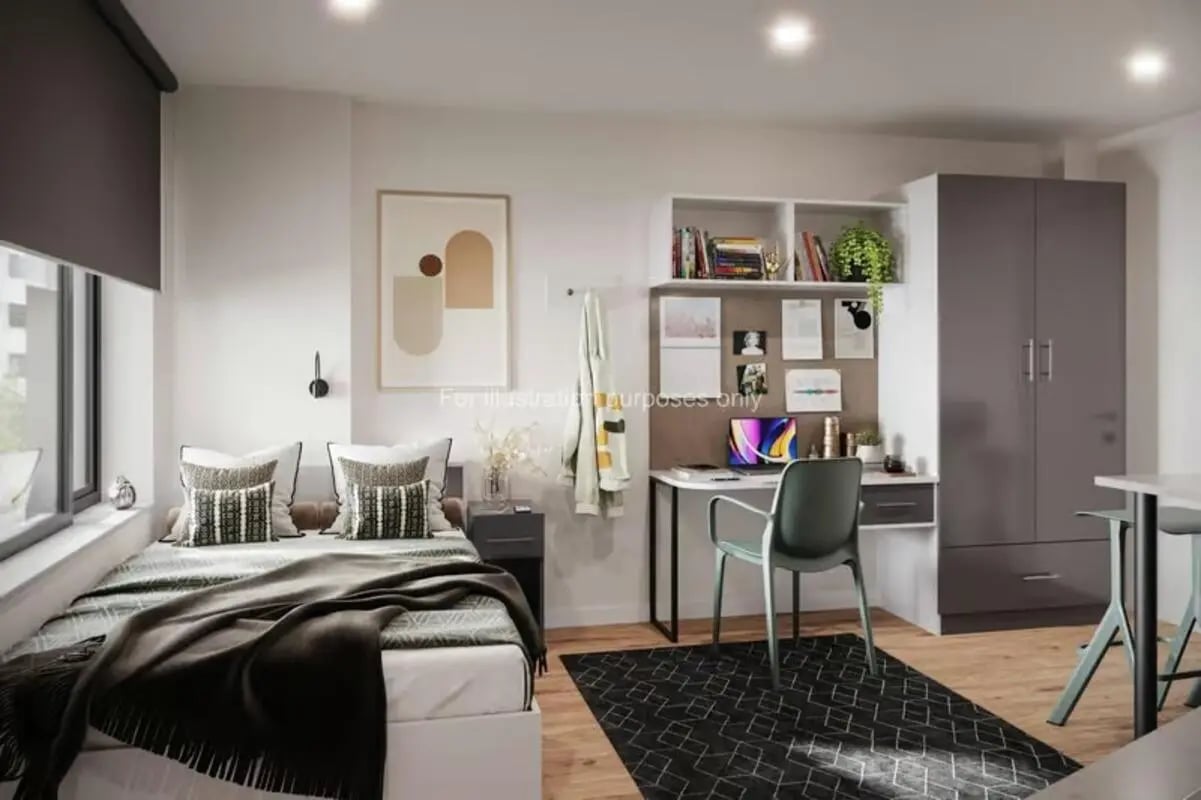 Bed desk wardrobe and rug bedroom at Sheares Hall in Newcastle Upon Tyne Student Accommodation