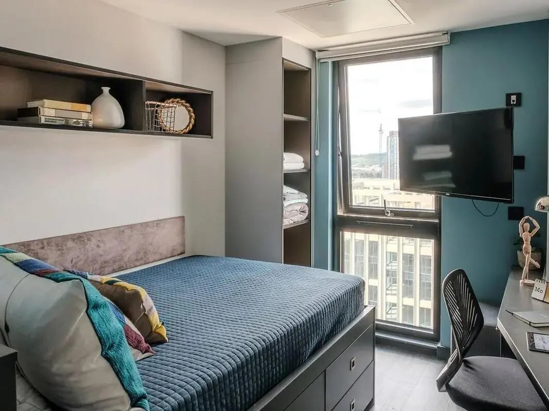 Bed shelves wardrobe television desk chair bedroom at Zenith in Cardiff Student Accommodation