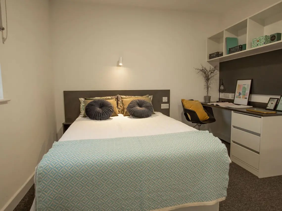 Bed with pillows and study desk bedroom at Canterbury Student Manor in Canterbury Student Accommodation