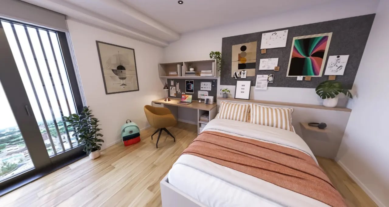Bed desk chair backpack and plants bedroom at Broadway Studios in Glasgow Student Accommodation