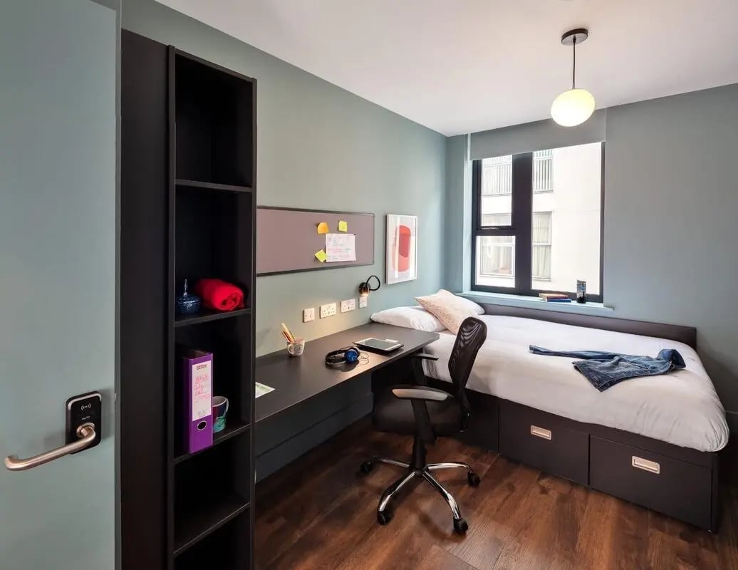 Bed desk chair shelf and window bedroom at Copley Court in Cork Student Accommodation