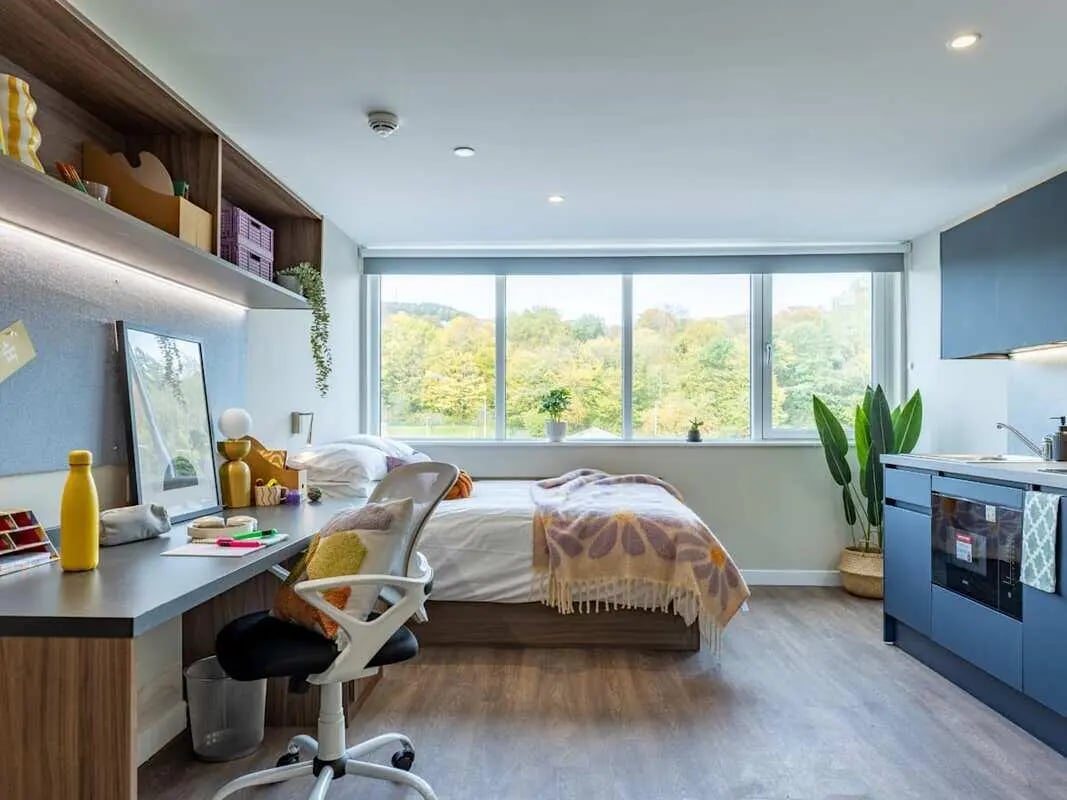 Bed desk chair kitchen with large window bedroom at Stanley Studios - Dundee in Dundee Student Accommodation
