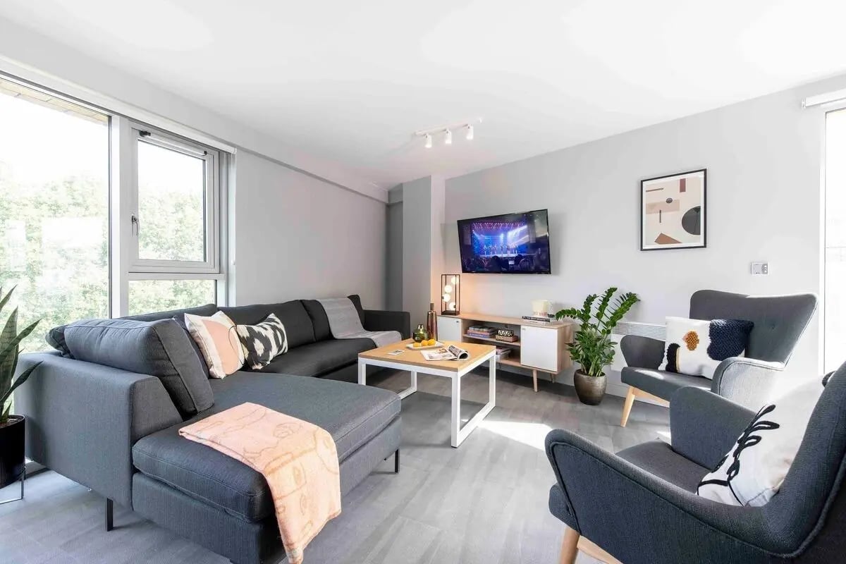 Sofa television coffee table chairs plant living room at Silk Mill Edinburgh in Edinburgh Student Accommodation